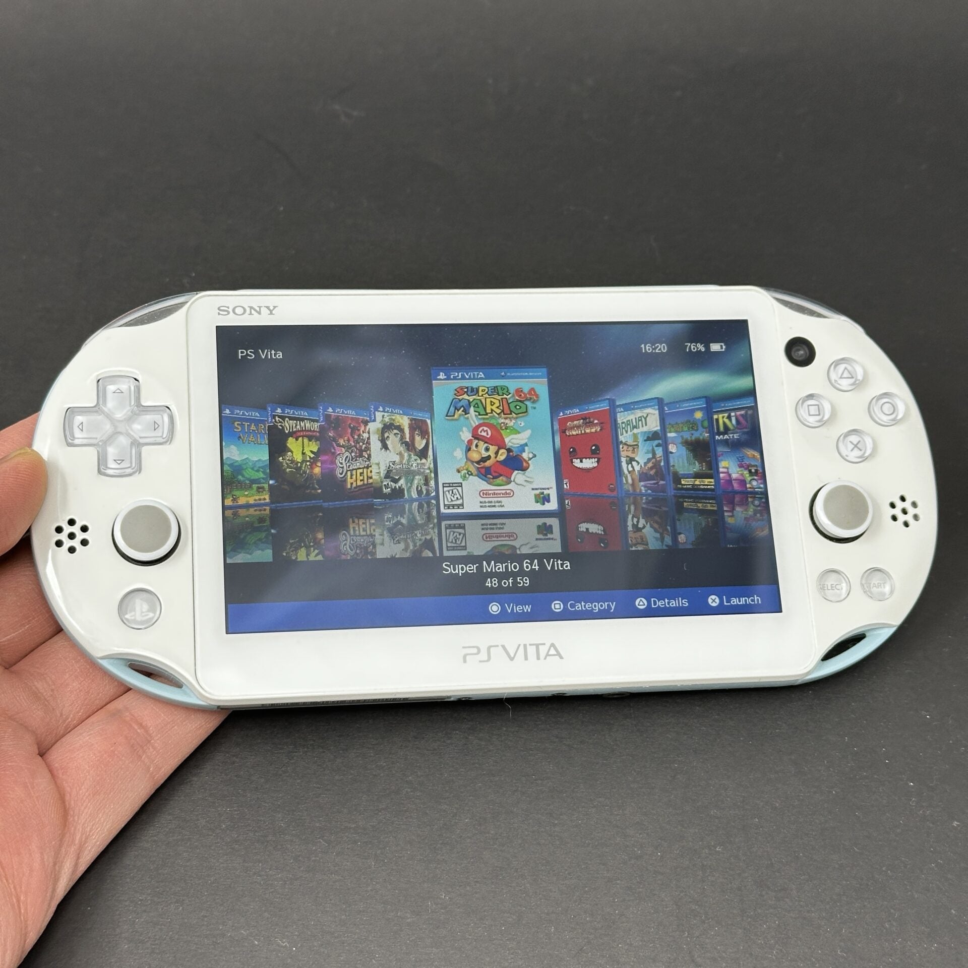 PS Vita Slim (128GB) – 580 Games | White and Blue